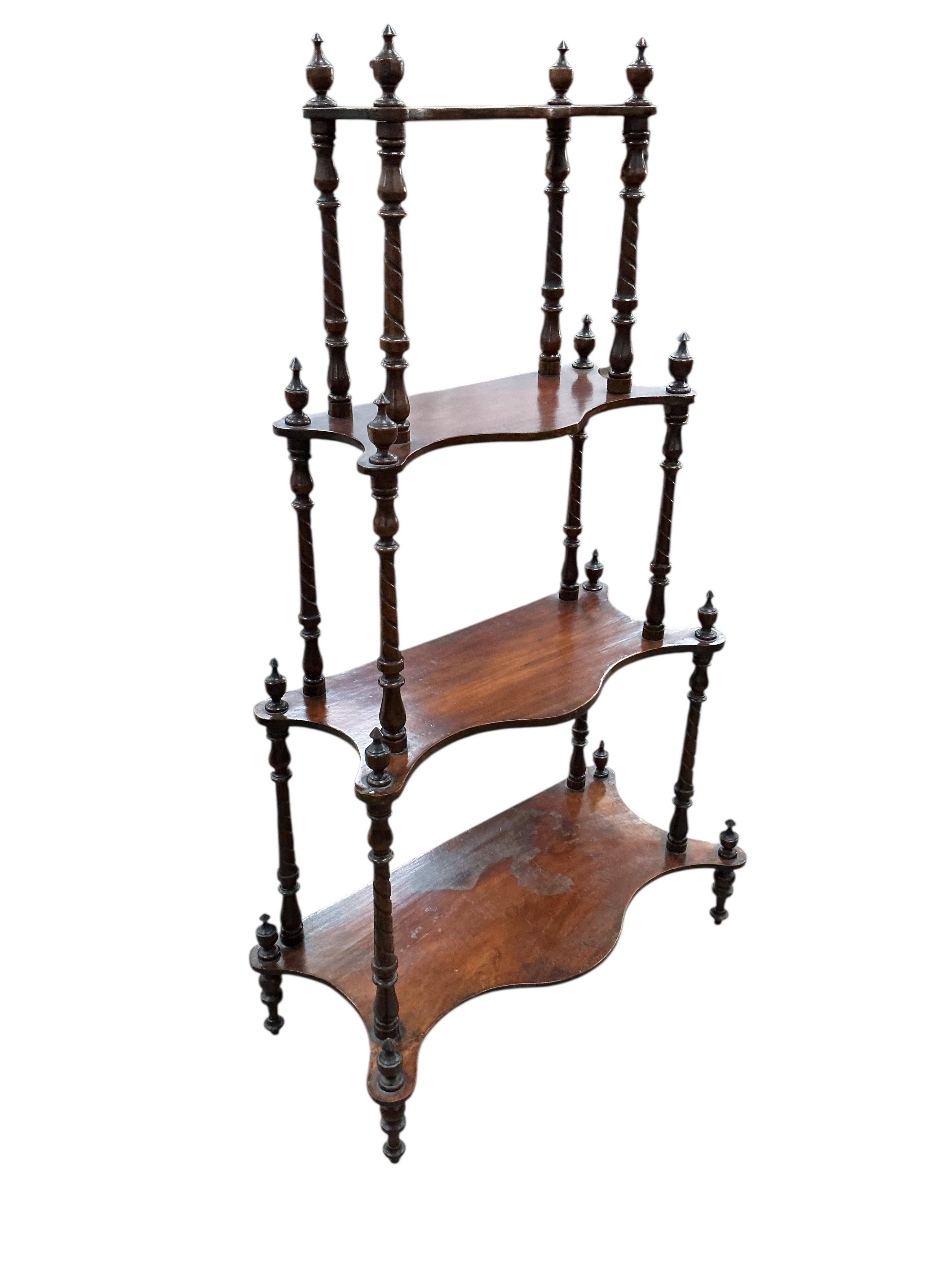 A Victorian mahogany four tier serpentine whatnot, width 65cm, depth 31cm, height 102cm
